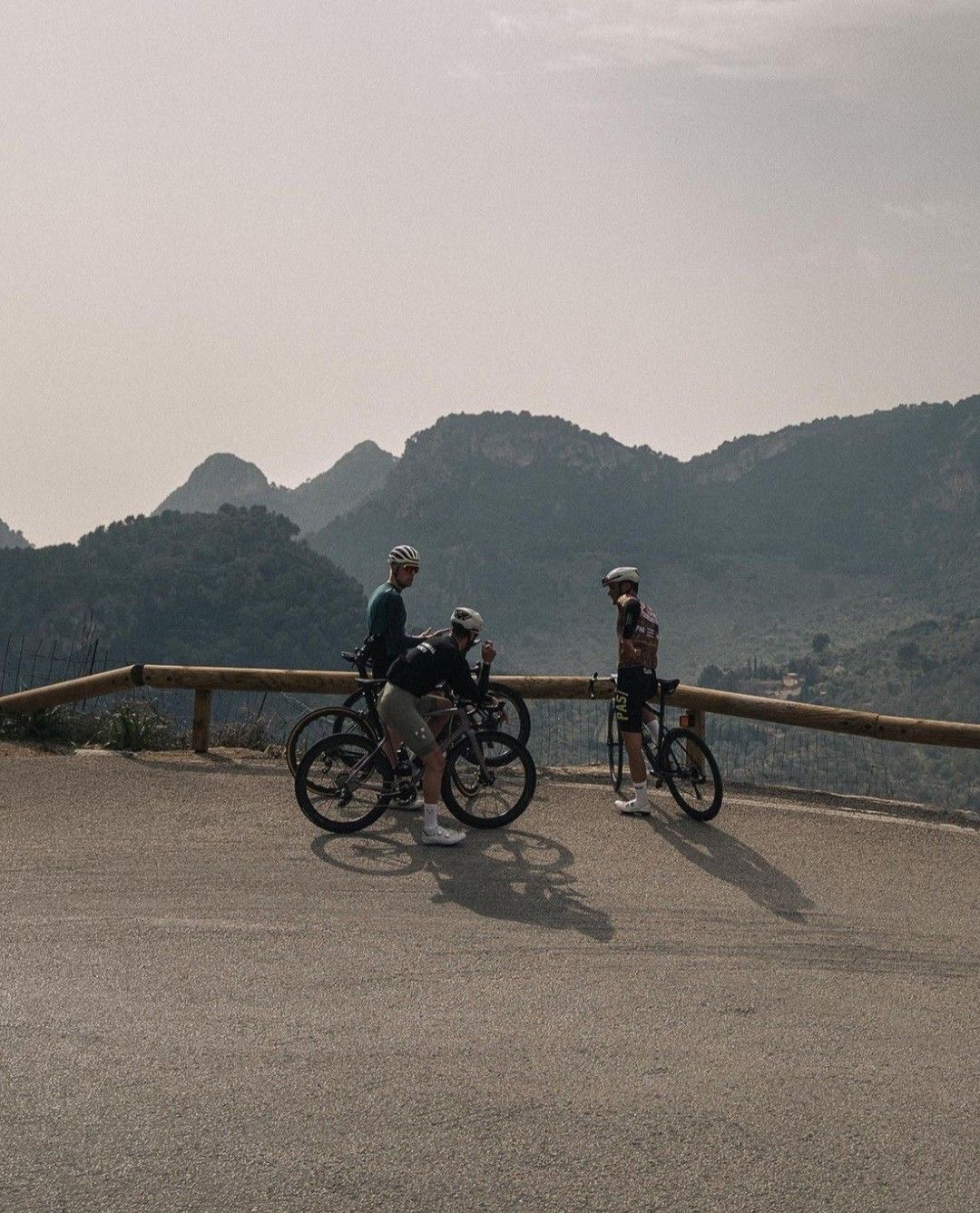 Riders resting on a mountain pass
