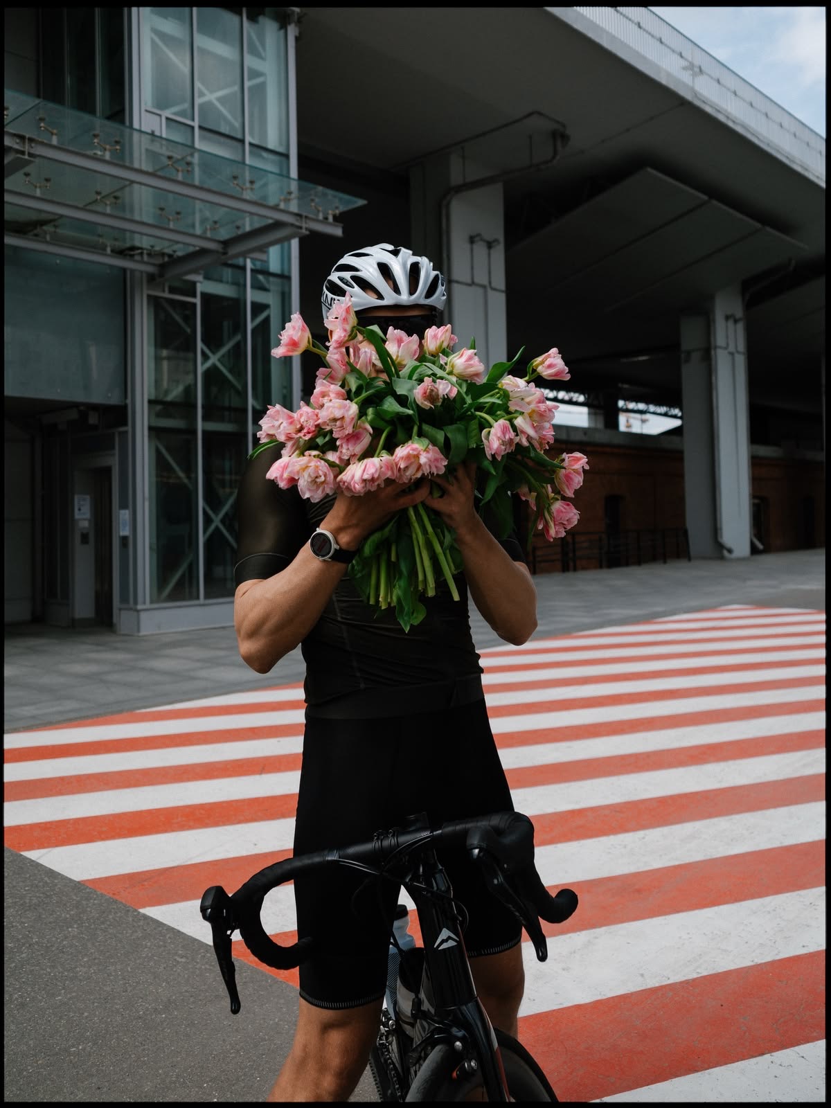 Rider carrying a bouquet of tulips home from a ride